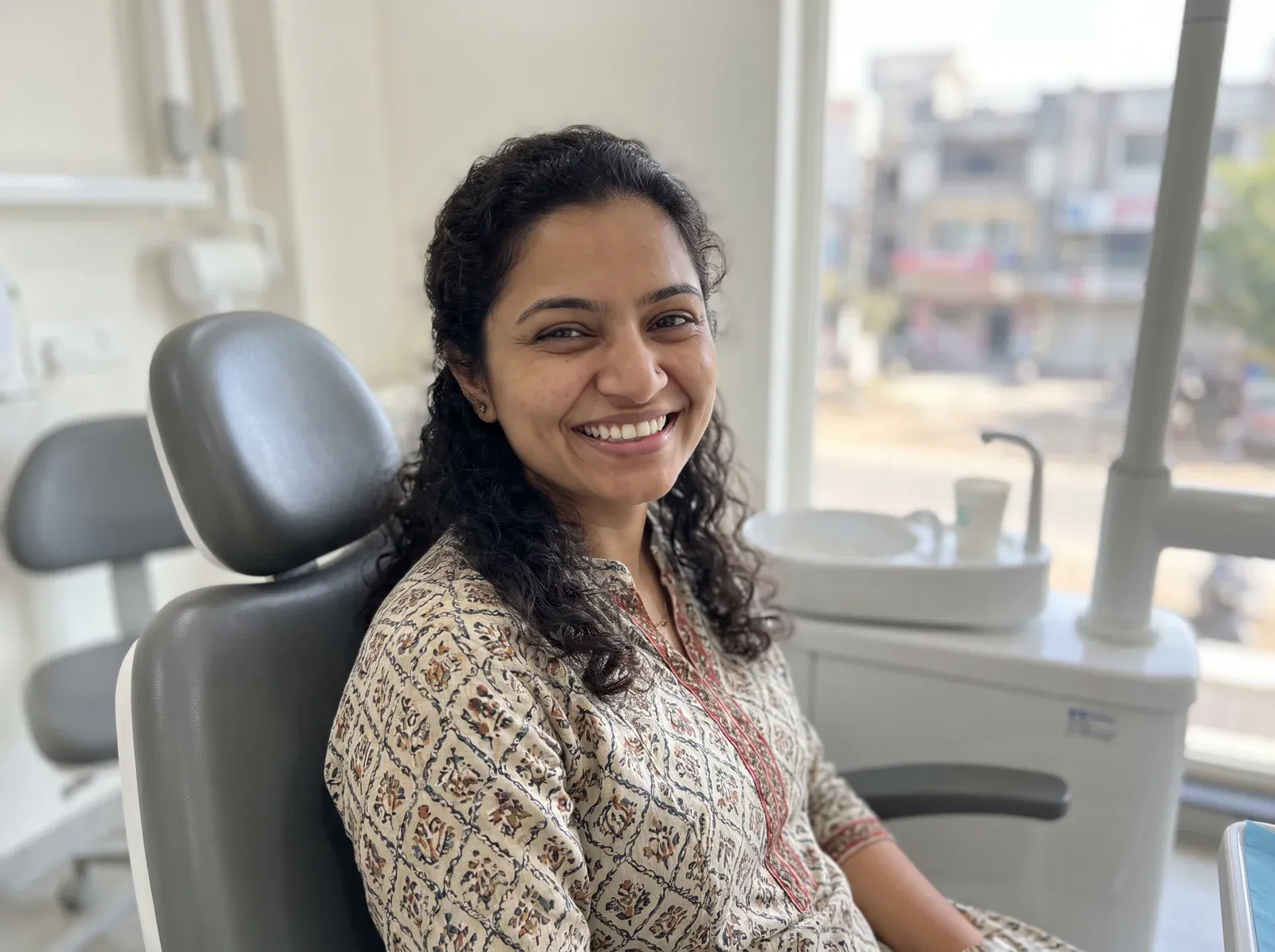 After: custom ceramic veneers — a natural, bright smile result