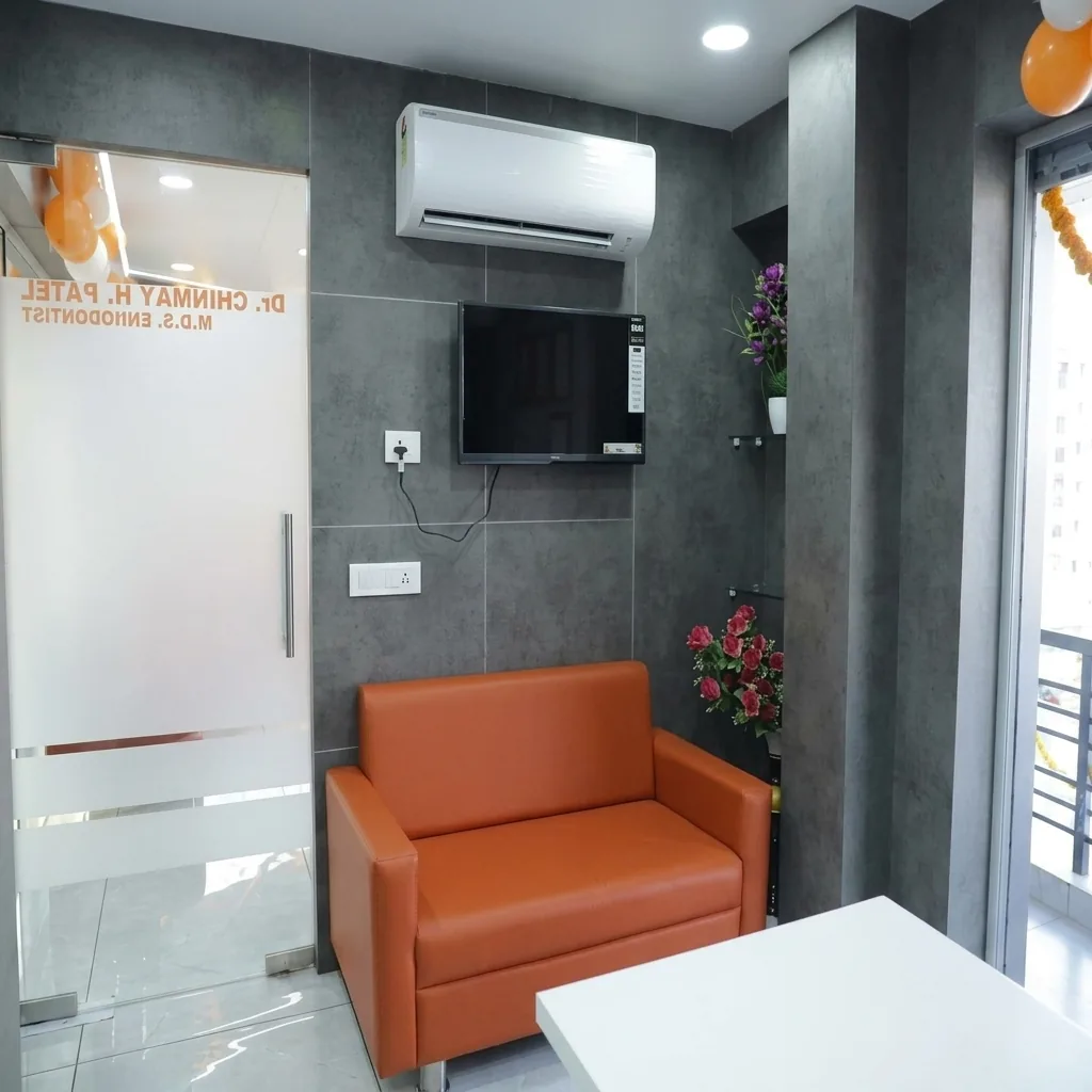 Private patient counselling room with comfortable seating at Pramukh Dental